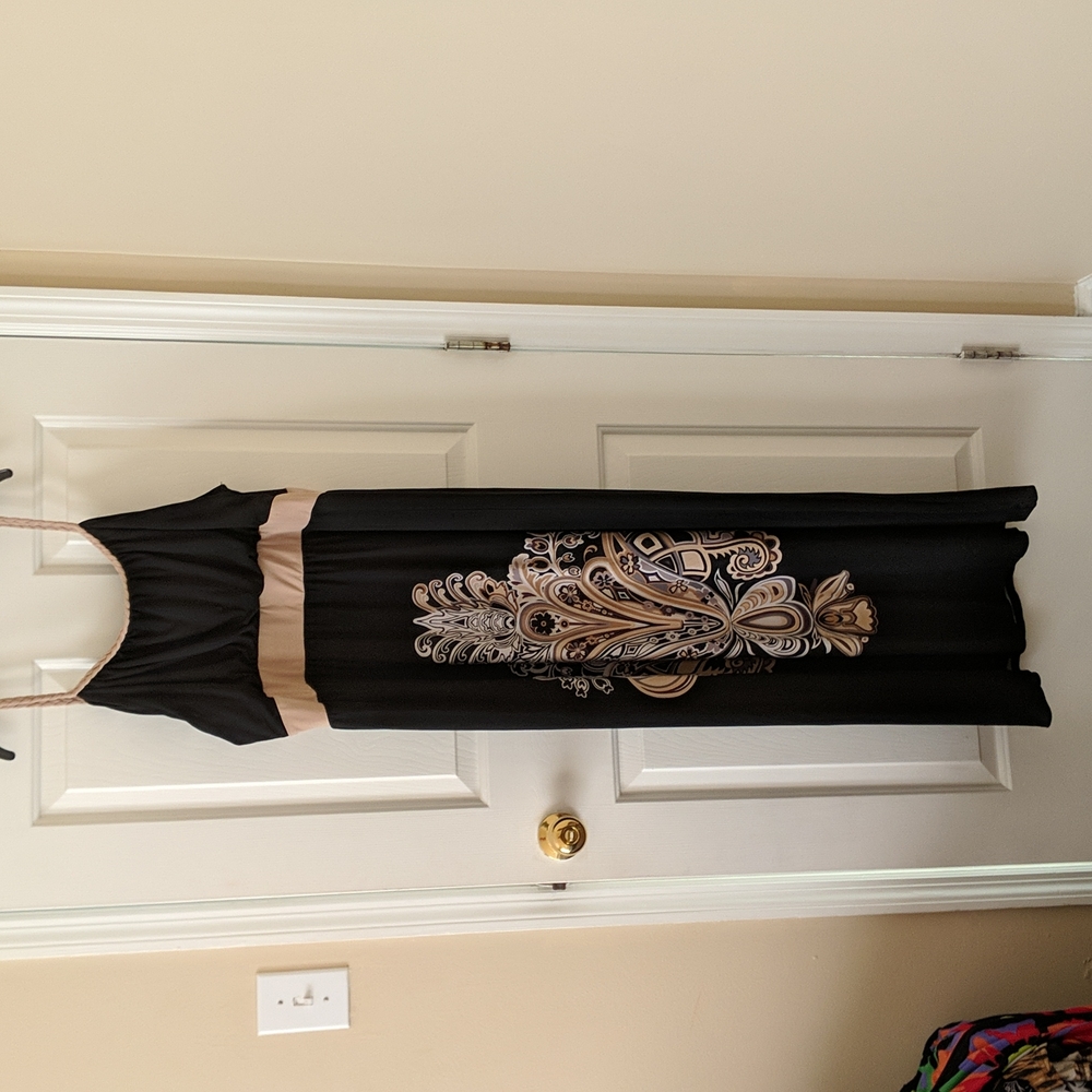 Slightly worn maxi dress with beautiful braided detailing around the shoulders.